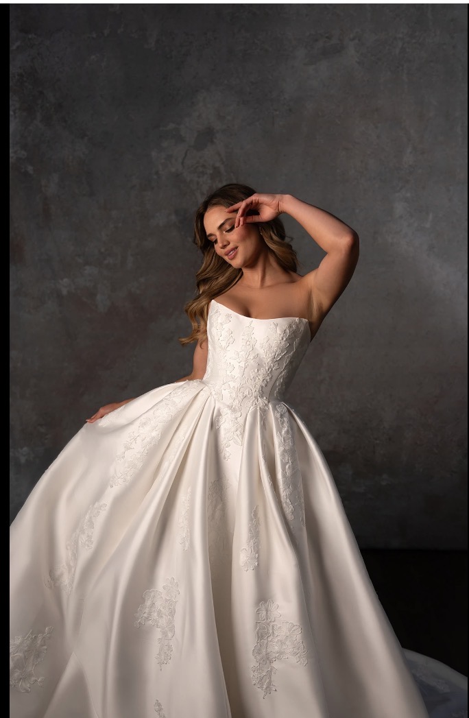 White bridal gown with floral detail.