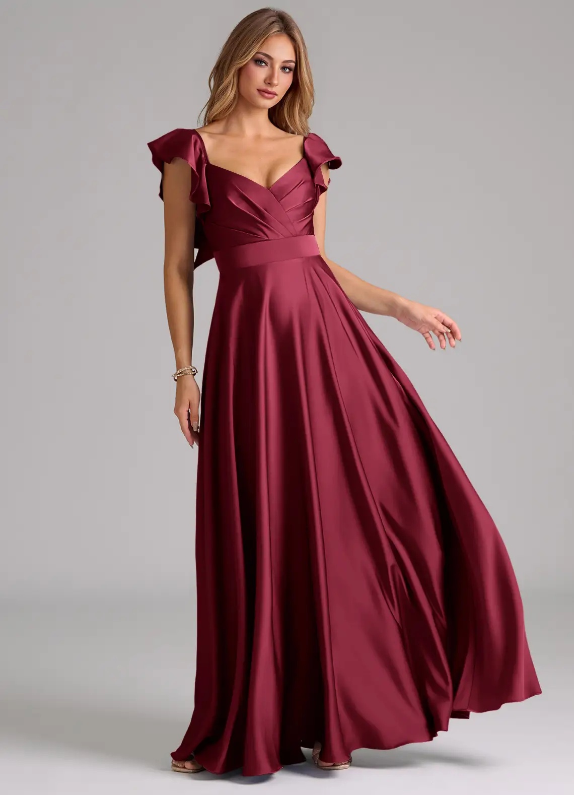Burgundy gown with flutter sleeves.