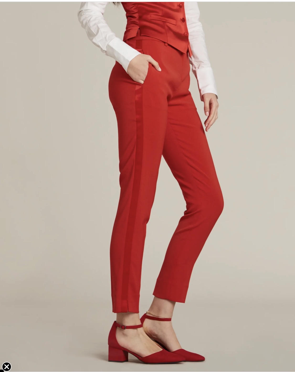 Red tailored trousers and waistcoat.