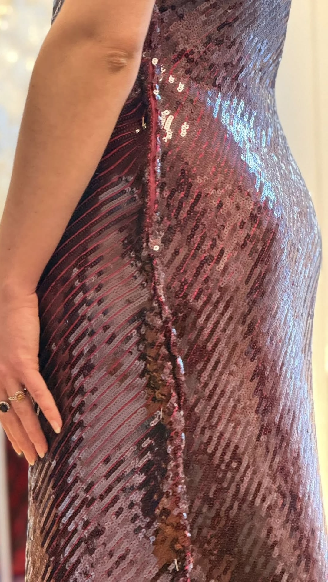 Pinned side seam on a sequined dress.